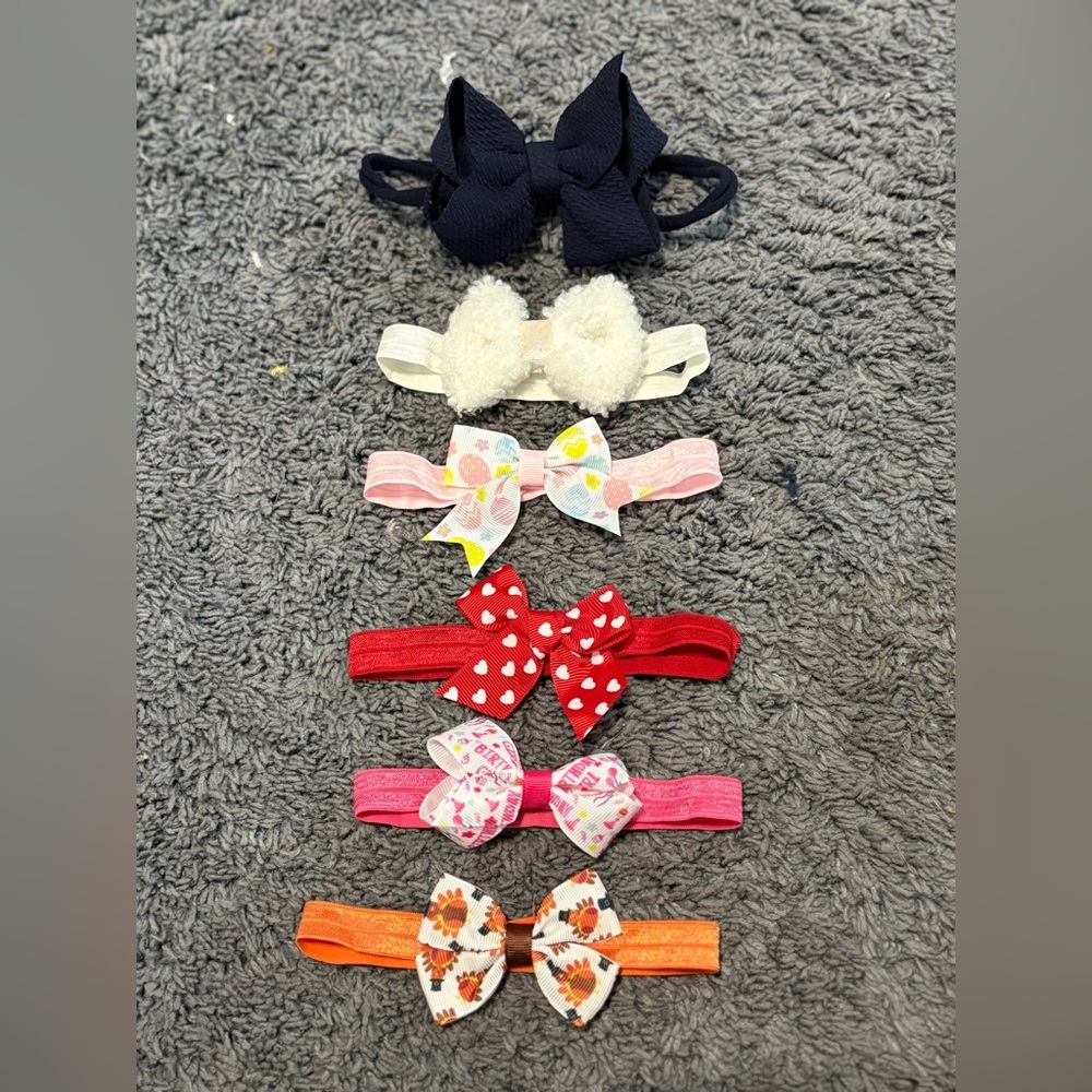 Lightly worn set of 6 baby headbands with bows